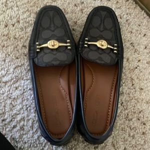 Black Coach monogrammed loafers with gold accent